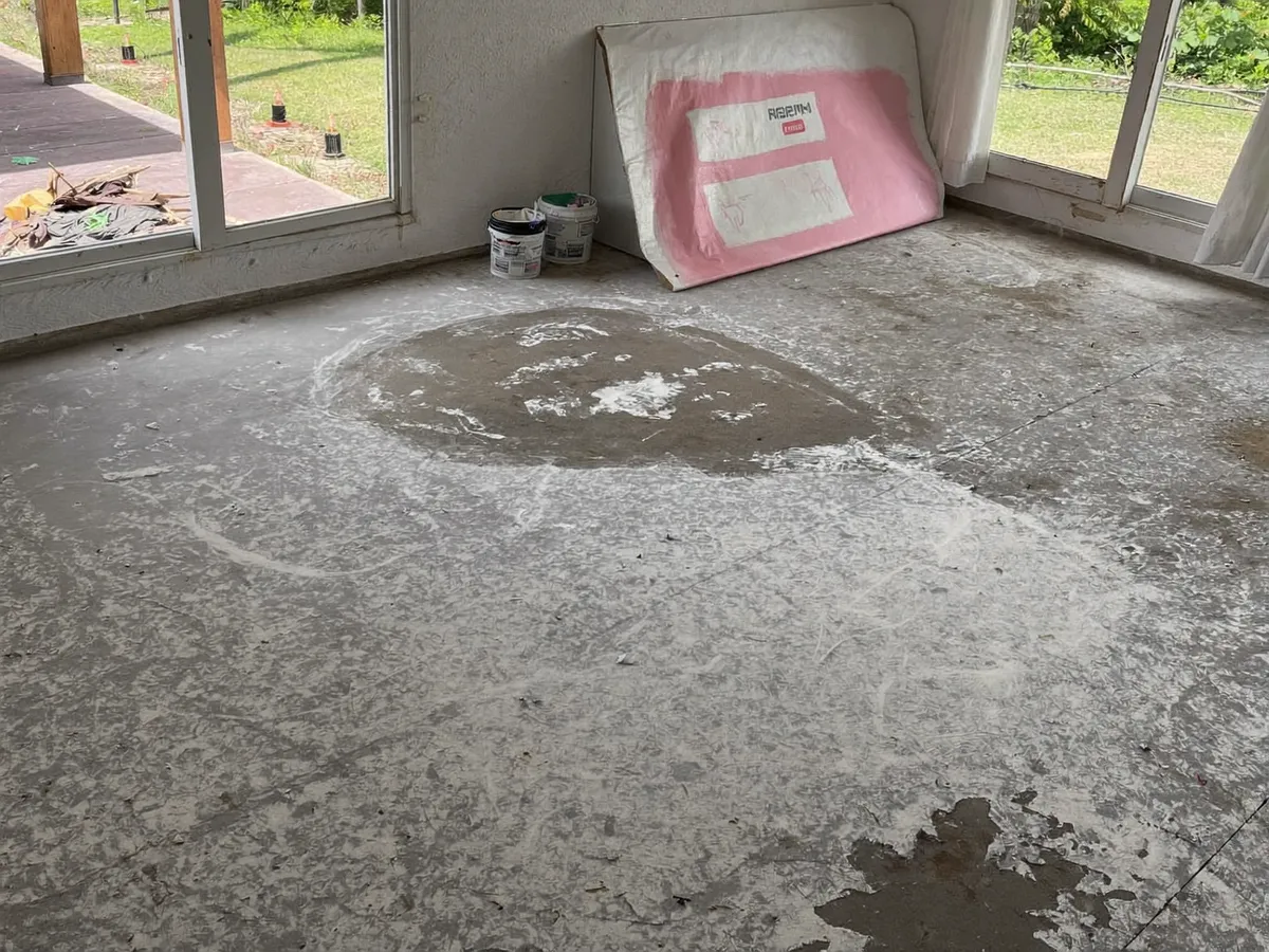 Construction dust covering a new Bali villa floor before post-build cleaning